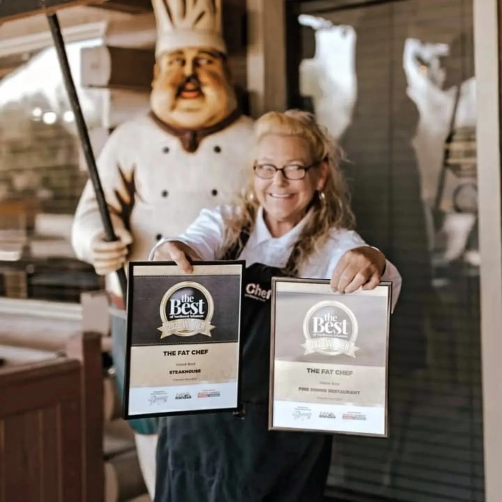 Richard and Christine holding their Best of Northwest Arkansas awards